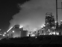 bw night shot of a refinery